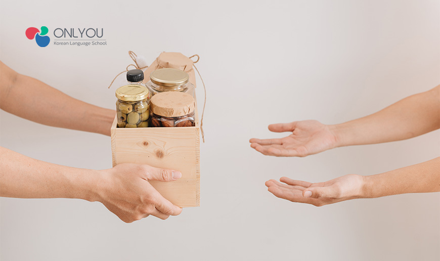 Receive items with both hands - Korean Classes Singapore