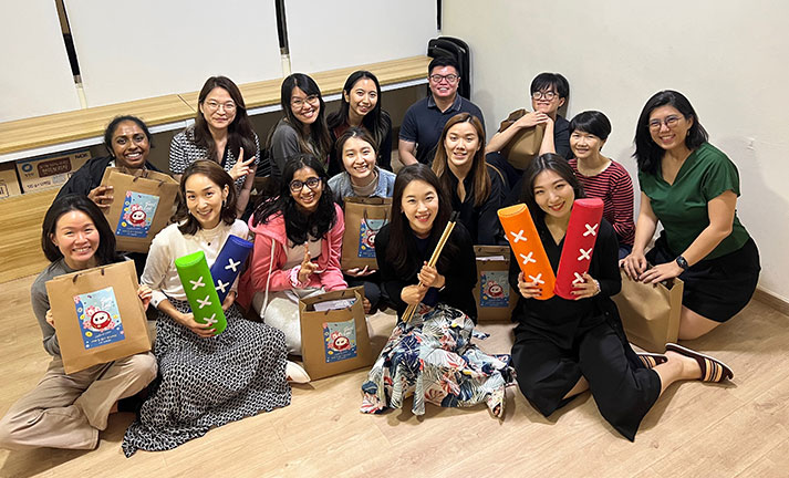Happy students celebrating a Korean festival together, demonstrating cultural immersion at the top Korean language education center with native Korean teachers.