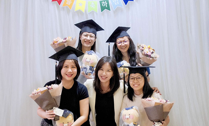 korean-master-course-graduation-ceremony-friendly-environment Graduated Master levels Korean language students with the school principal, celebrating in a friendly classroom environment ceremony after finishing the course.