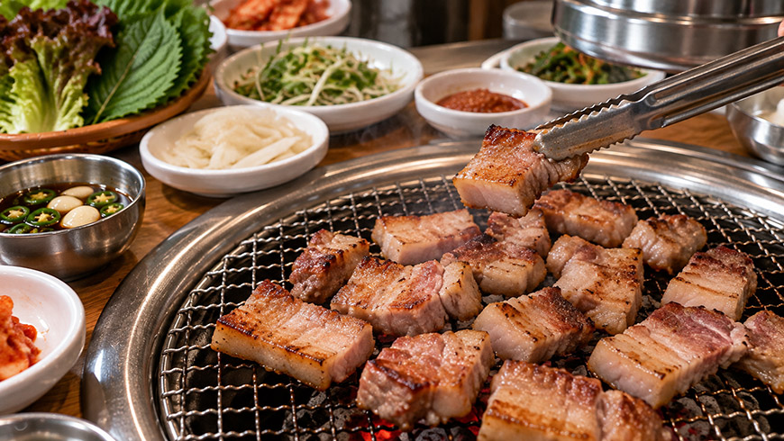 jeju-black-pork-korean-bbq Jeju black pork grilling on a Korean barbecue